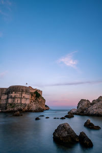 Scenic view of sea against sky at sunset