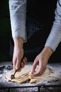 Midsection of man preparing food