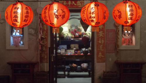 Illuminated lanterns hanging at night