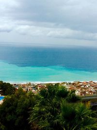 Scenic view of sea against cloudy sky