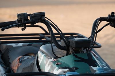 Close-up of quad bike at desert