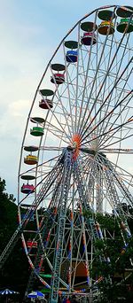 Low angle view of ferris wheel against sky