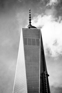 Low angle view of tower against cloudy sky