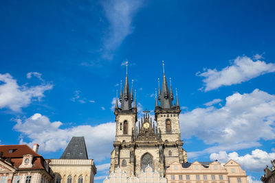 Low angle view of cathedral against cloudy sky