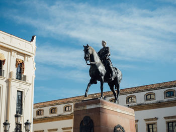 Low angle view of statue against sky