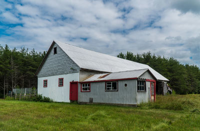 House on field against sky