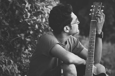Man playing guitar at music concert