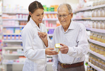 Pharmacist giving medicine to patient