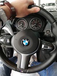 Close-up of hand holding vintage car