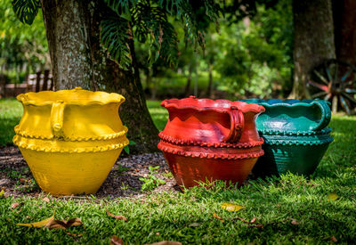 Colorful traditional pottery on field