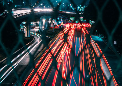 Light trails on road in city at night