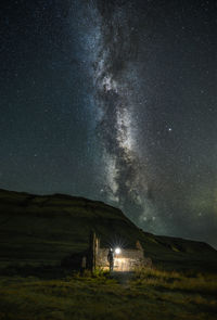 Scenic view of field against sky at night