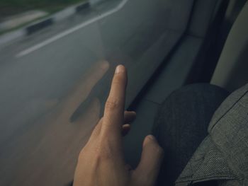 Close-up of man hand in car