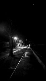Empty road in city at night