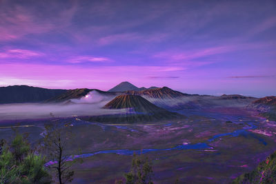 View of volcanic landscape against sky during sunset