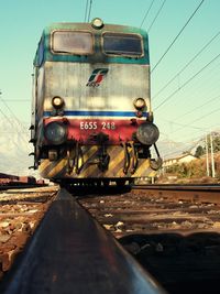 Train on railroad track against sky