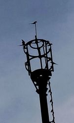 Low angle view of street light against sky