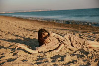 Young woman relaxing at beach