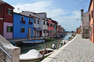 Boats moored at harbor