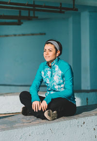 Portrait of woman sitting outdoors