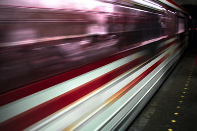 Blurred motion of train at railroad station