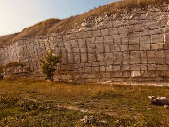 View of stone wall with mountain in background