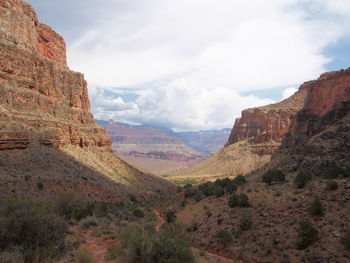 Scenic view of rocky mountains against sky