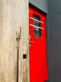 Close-up of red closed door of building