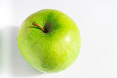Close-up of apple against white background