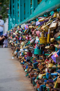 Close-up of padlocks hanging on railing