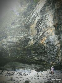 Full length of woman standing on rock