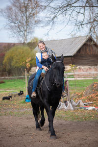 Man riding horse on field