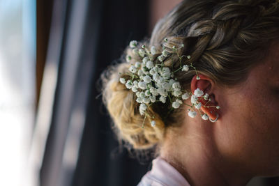 Close-up of woman wearing flowers