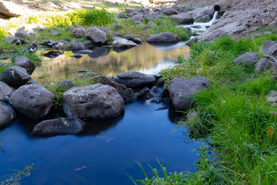 High angle view of rocks in lake