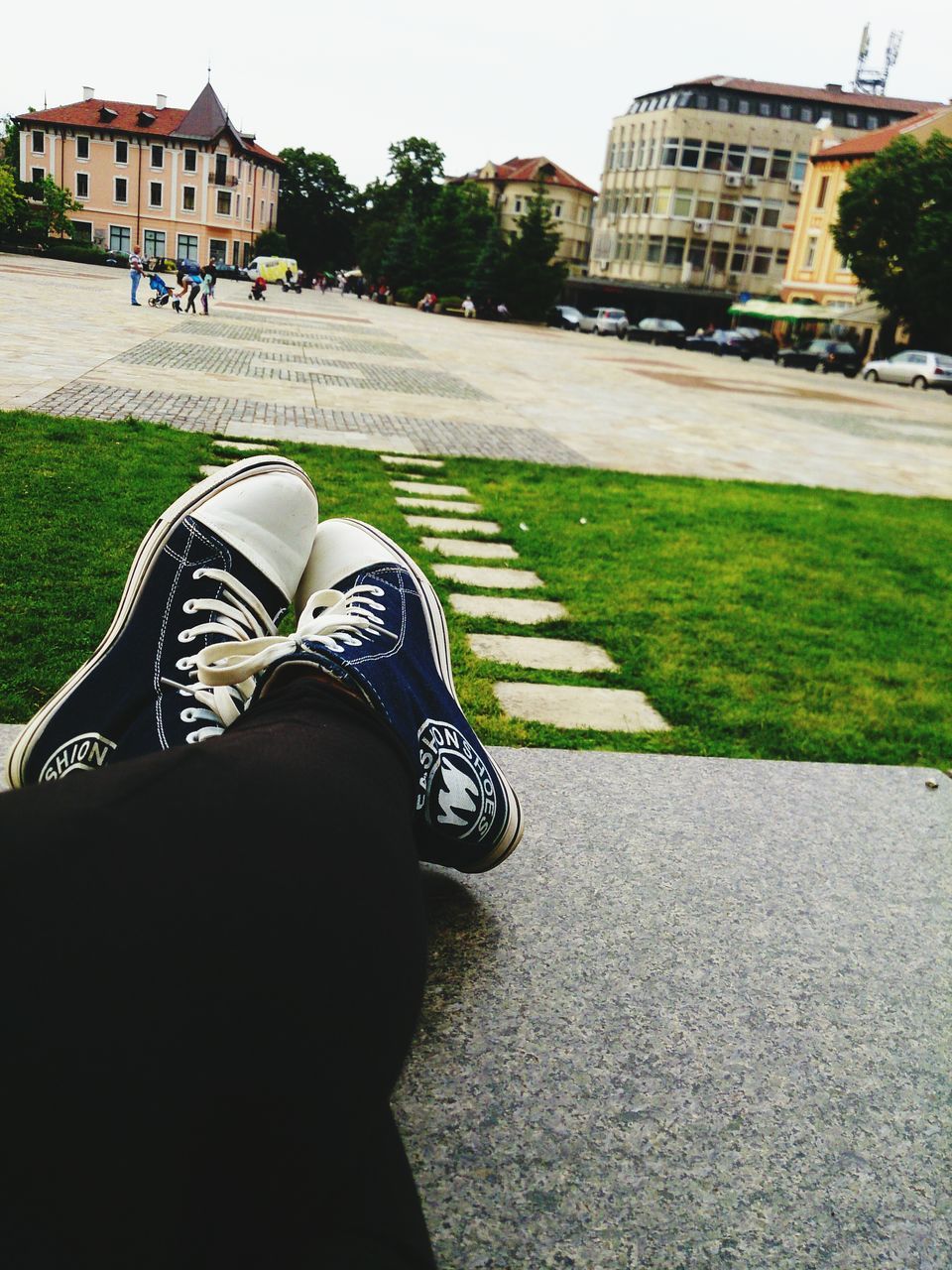 building exterior, architecture, low section, built structure, shoe, grass, person, lifestyles, street, leisure activity, men, day, outdoors, lawn, city, personal perspective, relaxation