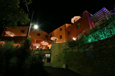 Low angle view of illuminated buildings at night