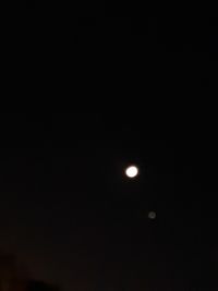 Low angle view of moon against sky at night