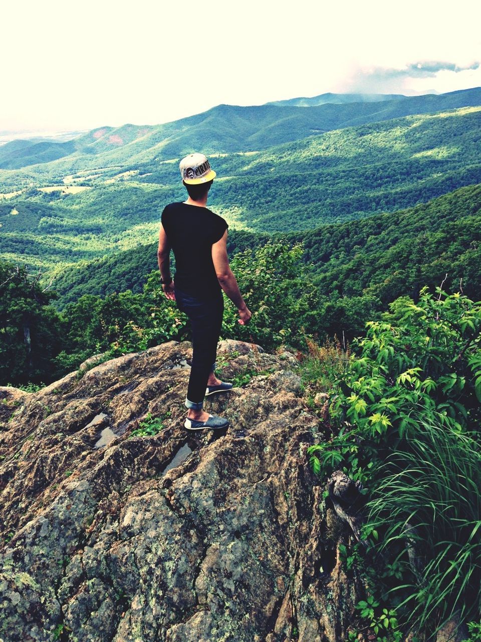 mountain, full length, lifestyles, leisure activity, rear view, casual clothing, tranquil scene, tranquility, standing, landscape, beauty in nature, nature, mountain range, scenics, hiking, men, getting away from it all, person