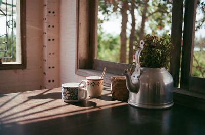 Tea cup on table at home