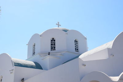 Low angle view of white building against clear blue sky