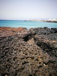 Scenic view of beach against clear sky