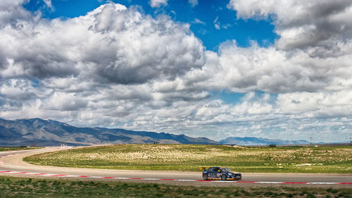 Scenic view of landscape against cloudy sky