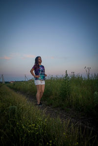 Woman standing on grass