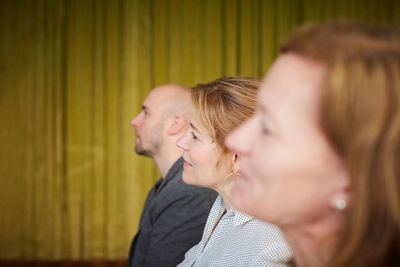 Businesswomen with male colleague in office seminar at workplace