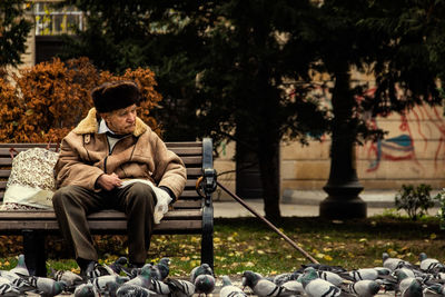 Man sitting on seat at park