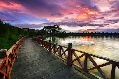Scenic view of lake against sky at sunset