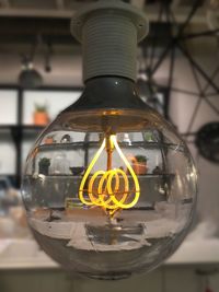 Close-up of illuminated light bulb