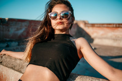 Portrait of young woman wearing sunglasses