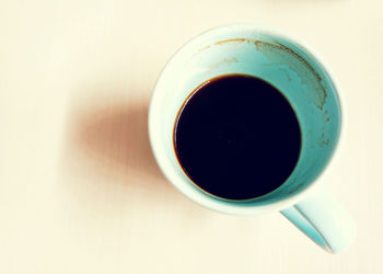 Directly above shot of coffee cup on white background