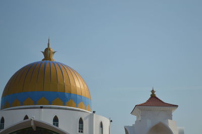 Low angle view of church against blue sky